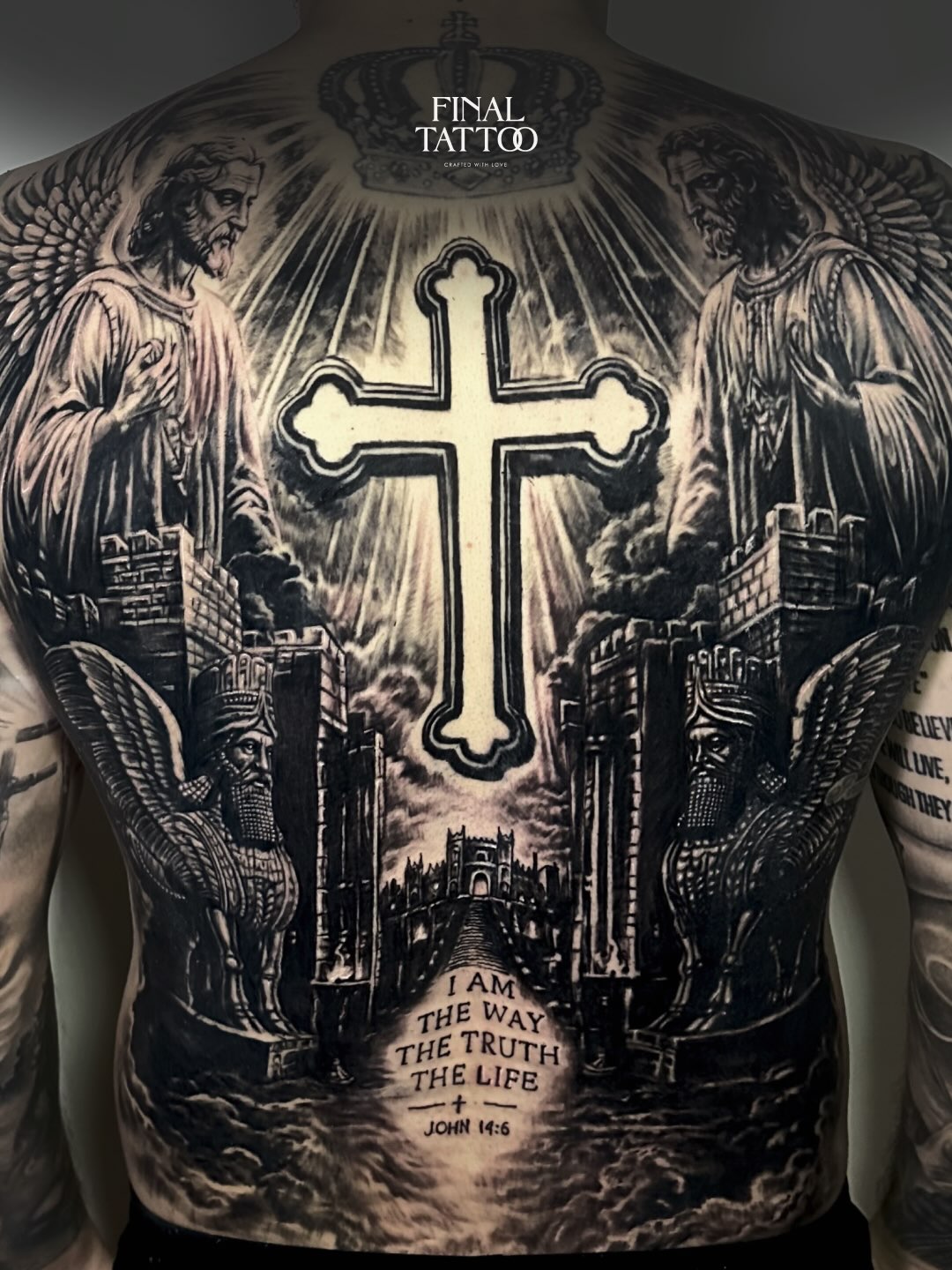 Complete black-and-grey back tattoo with angels and a central cross, original work by Final Tattoo Bali